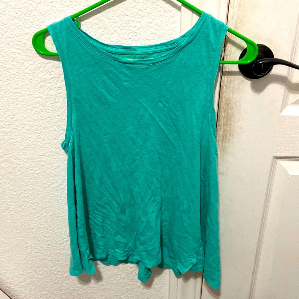 A teal solid colored shirt